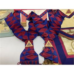 Two Masonic kid leather aprons, one with sash and cuffs, the other with sash, each marked 'Yorkshire North and East Ridings'; and three other unmarked Masonic aprons with sashes