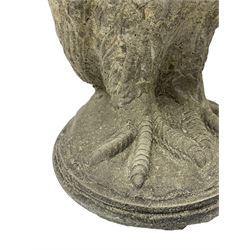 Pair of cast stone garden owls figures, on circular moulded plinths 