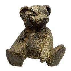 19th century cast iron door stop, modelled as a seated toy bear, with remnants of painted finish, H22.5cm