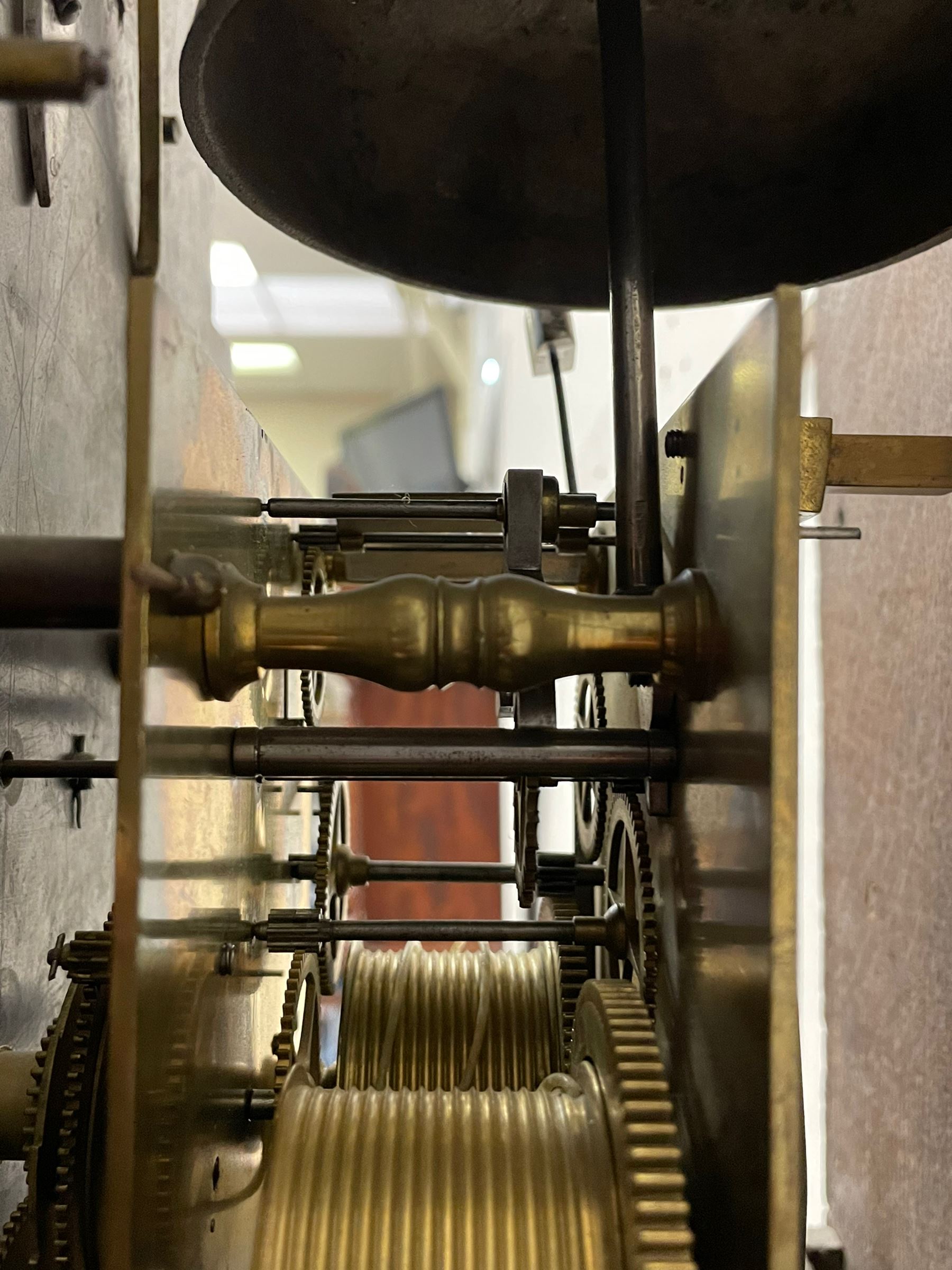 Henry Hindley of York – mid-18th century oak cased 8-day longcase clock,
flat topped caddy pediment with gesso finials, rectangular hood door flanked by wooden turned pilasters with capitals, canted trunk with a full-length break arch topped door on a short plinth with applied skirting and bracket feet, brass dial with a silvered chapter ring, Roman numerals and five-minute Arabic’s, minute and inner quarter hour tracks, matted dial centre with subsidiary seconds dial, blued steel hands and female head pattern spandrels, silvered calendar dial to the break arch with dolphin spandrels, four pillar rack striking movement, striking the hours on a bell. With weights and pendulum. 
H250 W48 D27
Henry Hindley originally from Wigan (Lancs) is recorded as working in York from Petergate 1731-41 then Stonegate 1741-1771. A famous and highly innovative maker, often referred to as the “Tompion of the North.” 
