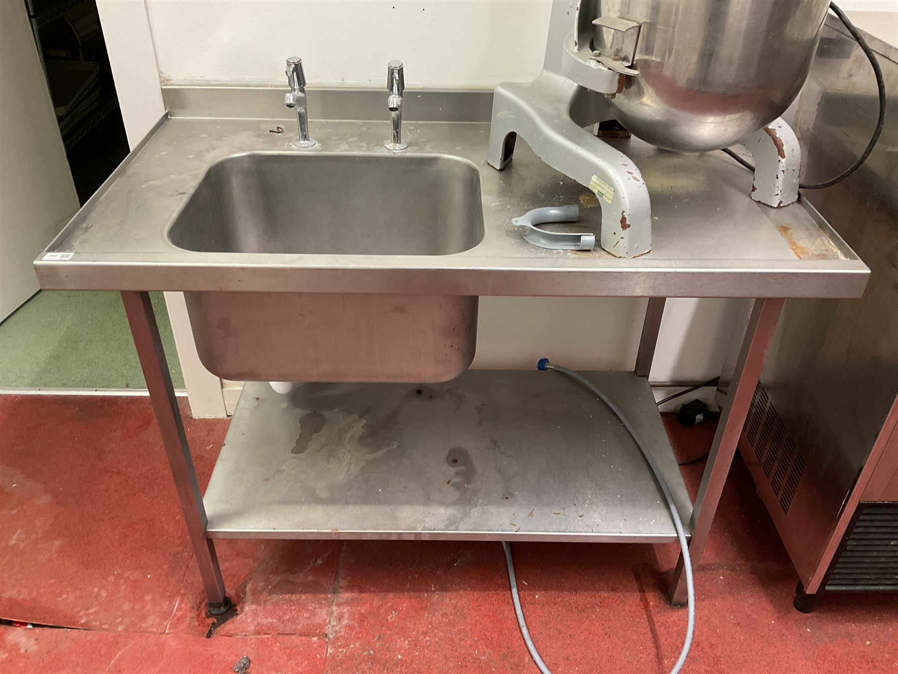 Stainless steel single sink unit with drainer and under-shelf- LOT SUBJECT TO VAT ON THE HAMMER PRICE - To be collected by appointment from The Ambassador Hotel, 36-38 Esplanade, Scarborough YO11 2AY. ALL GOODS MUST BE REMOVED BY WEDNESDAY 15TH JUNE.