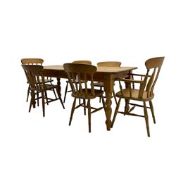 Pine farmhouse dining table, rectangular top with rounded corners, raised on turned supports; together with a set of six (4+2) spindle-back dining chairs