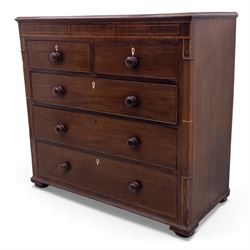 Early 19th century mahogany chest of drawers, the rectangular top with boxwood line inlay above two short and three long graduating drawers, each with turned wooden knobs and bone escutcheons, flanked by fluted uprights with diamond inlaid panels, on shaped bracket feet