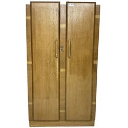 Early 20th century Art Deco period oak Gentleman's wardrobe, the interior fitted with shelves, hanging rails and two long drawers