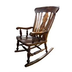 Late 19th century elm and beech farmhouse rocking chair, pierced splat and lath high back over saddle seat with turned supports