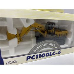 Four Joal Komatsu 1:50 scale die-cast models comprising WA600-3 Log Loader, HD605-5 Dump Truck and two PC1100LC-6 Material Handler, together with a CAT Articulate Truck, all boxed (5)