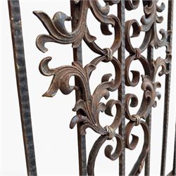 Victorian wrought iron vineyard gate, with ornate scrollwork and foliate acanthus leaf decoration, shaped cresting and central decorative panel, finished in rustic black painted finish