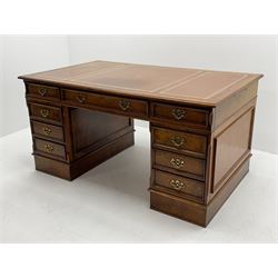 Victorian style figured elm twin pedestal desk, moulded rectangular top with inset leather, fitted with seven drawers, the lower two filling drawers are double height, the opposing side fitted with false drawers, each side fitted with pull slides with leather insets, skirted base