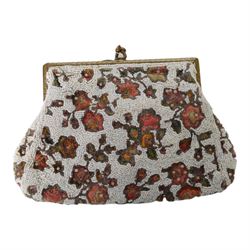 Early 20th century ostrich feather and mother of pearl fan, together with four loose ostrich feathers and a French beadwork clutch bag