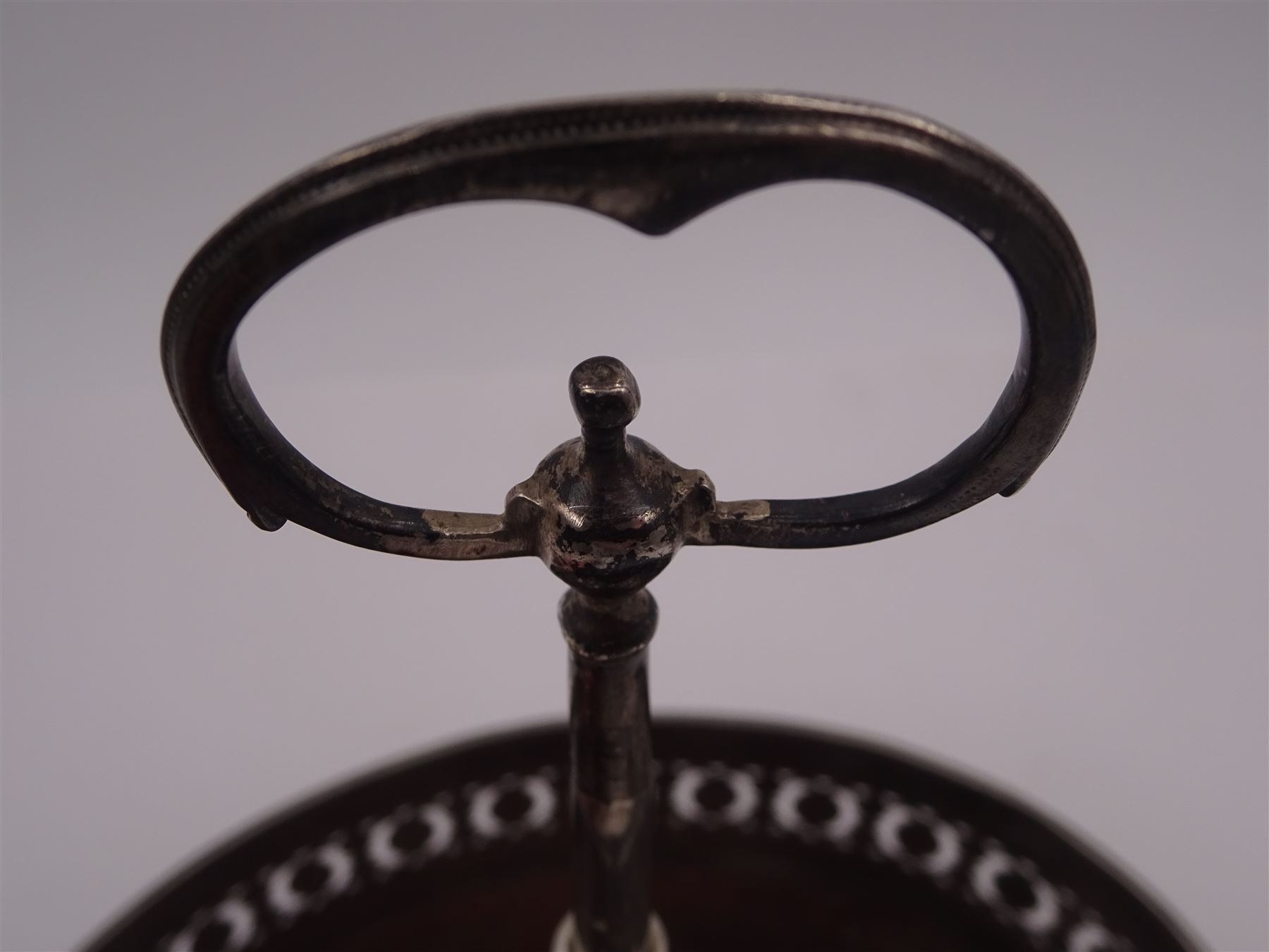 Late 18th century silver cruet stand, of oval form, with pierced sides upon four bun feet, hallmarked to handle Hester Bateman, all other hallmarks indistinct, together with five matched silver mounted cut glass cruet bottles, including some later Victorian examples, hallmarks predominantly indistinct, stand H20cm