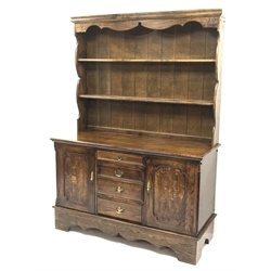  18th century style medium oak dresser, two tier plate rack, four graduating drawers flanked by two cupboards, shaped plinth base, W137cm, H190cm, D54cm  