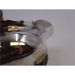 Pair of silver sauce boats, of typical plain form, with acanthus capped flying scroll handle and each upon three hoof feet, hallmarked Walker & Hall, Birmingham 1901, H9cm