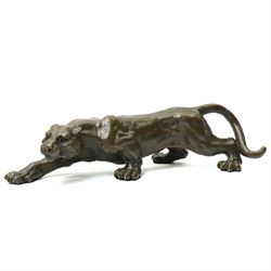 Bronze figure, modelled as a cougar in crouching pose, after Milo and with foundry mark, L42cm 