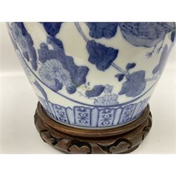Chinese blue and white table lamp of baluster form, decorated with birds and floral displays, on hardwood base with shade, H78cm