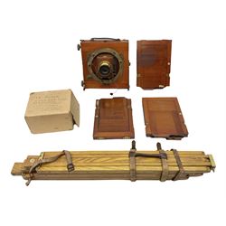 Thornton Pickard Imperial Triple folding plate camera in mahogany and lacquered brass, field model, three mahogany photographic plates and a wooden tripod