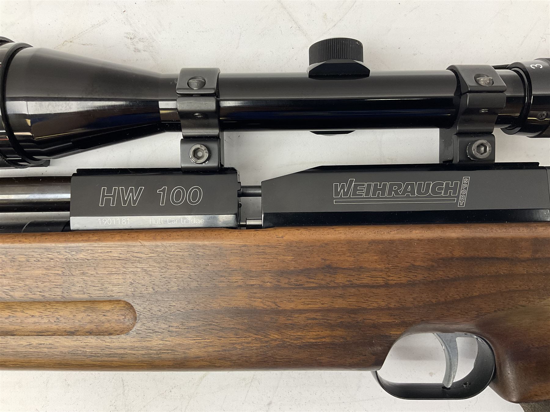 Weihrauch HW100 .22 calibre PCP repeating air rifle; walnut thumbhole stock with textured pistol-grip; Nikko Stirling Silver Crown 3-9x40 telescopic sight; integral sound moderator; No.1901181 L99cm overall; in gun sling; with Logun Combi-Pump and quantity of pellets