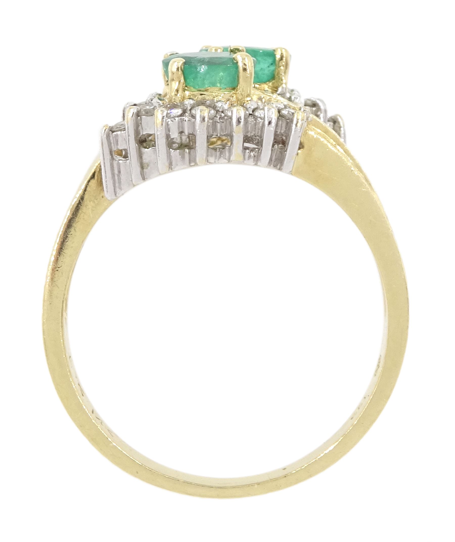 14ct gold emerald and diamond crossover ring, two oval cut emeralds with round brilliant cut diamond surround, with channel set calibre cut emerald shoulders, stamped 585