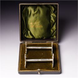 Pair of late Victorian silver knife rests with scroll moulded decoration Sheffield 1898 Ma...