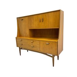 G-Plan mid-20th teak 'E Gomme' wall unit or sideboard, fitted with fall-front drinks cabinet and double cupboard, over two drawers and fall-front cupboard, on tapering supports