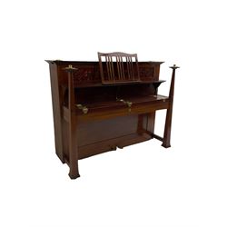 Carl Bechstein - late 19th century German overstrung upright piano, in a model 4 Arts and Crafts case designed by Walter Cave, with a lattice music desk and fretted silk backed front panel, brass hinged case lid and key fall with square tapered candle holders and circular sconces, iron frame, serial number 52187 (1899-1900), with an under damper action, 85 ebony and ivory keys, sustain and una corda pedals, original action, stringing, dampers, and action return straps, registered case number 328639, USA patent 24805.

This item has been registered for sale under Section 10 of the APHA Ivory Act