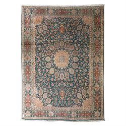 Persian Tabriz type carpet, the teal ground decorated with central medallion, radiating pa...