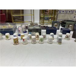 Quantity of thimbles to include twelve Irish Dresden lace examples, Royal Crown Derby, Spode, Portmeirion, Wedgwood, Royal Grafton etc, together with three display cases, many with certificates