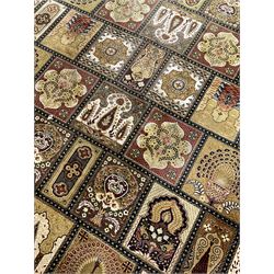 Persian design carpet, the field with various size tiles decorated with stylised plant motifs, floral urns and peacocks, the main border decorated with repeating foliate motifs and trailing flower heads