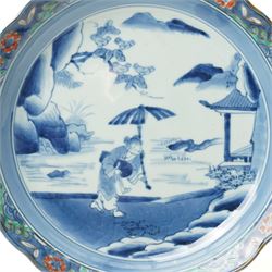 Japanese 19th century Arita style dish, painted centrally in blue and white with a lady carrying peaches, marked in blue to base, W28.5cm 
