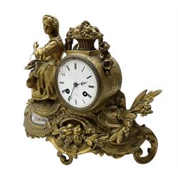French-Gilt-metal mantle clock c1870, with a seated figure of a lady holding a pair of scales, on a scroll base with a porcelain panel on a blue ground depicting a floral spray of flowers, with brass castings of fruit and foliate decoration, enamel dial signed Henry Marc, Paris, with Roman numerals and steel moon hands, twin train countwheel striking movement sounding the hours and half-hours on a bell. With pendulum and key.