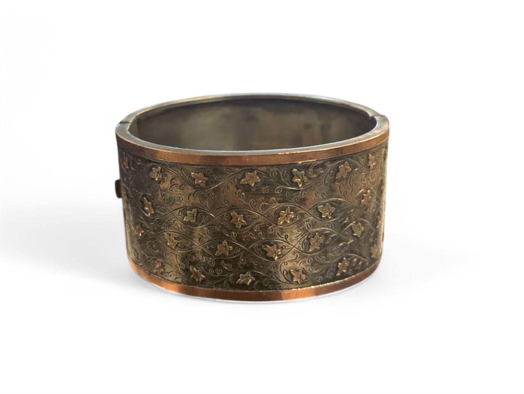 Victorian silver bangle with gold overlay leaf design 