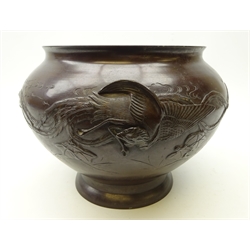  Japanese Meiji period patinated bronze jardiniere, relief decorated with an exotic bird, the feathers trailing exaggeratedly along the body, amidst clouds and foliage, D25cm x H21cm   