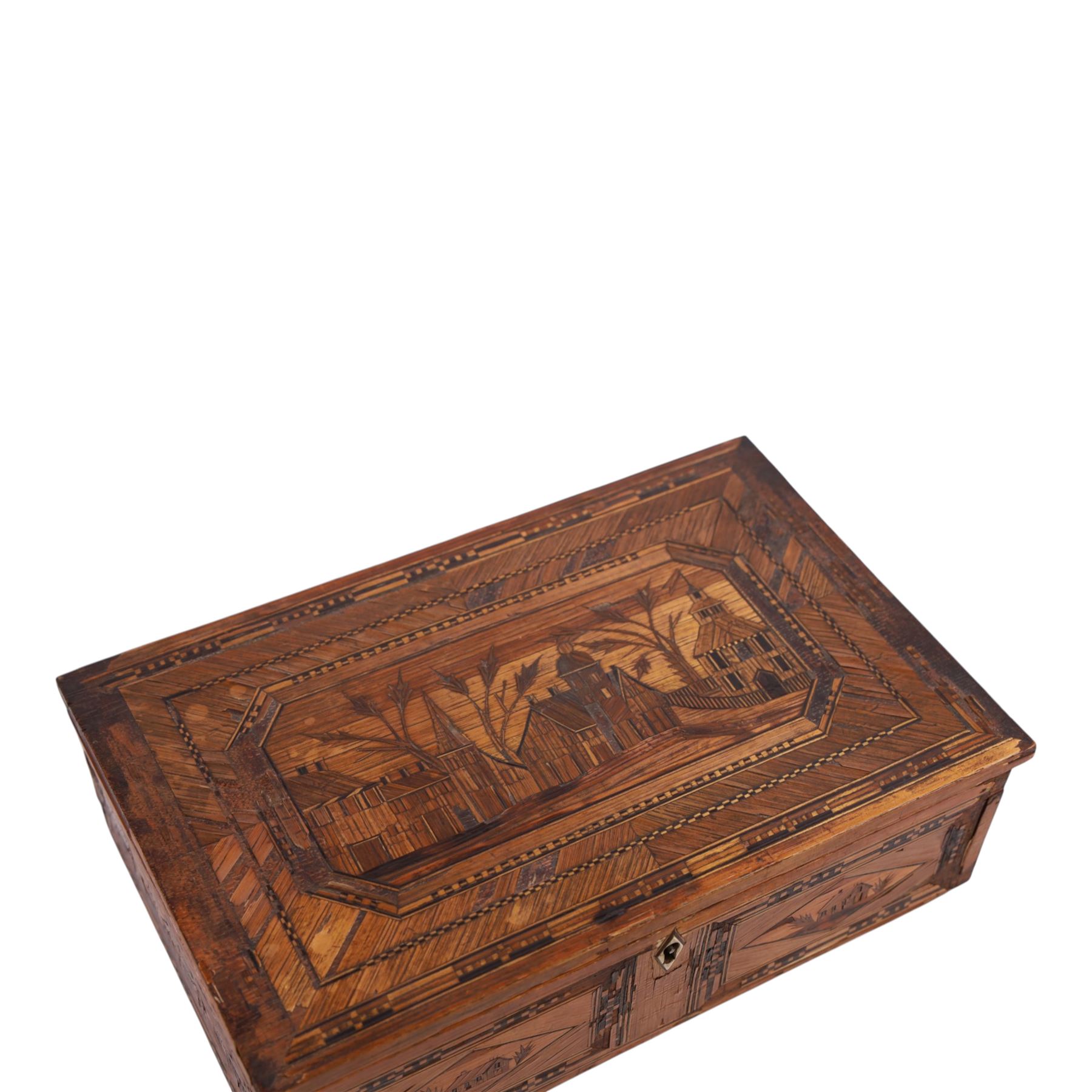 Napoleonic prisoner of war straw work box, the exterior with panels of buildings in geometric borders, the interior of the hinged lid opening to reveal two compartments with hinged covers decorated with flowers, H8cm, D16cm