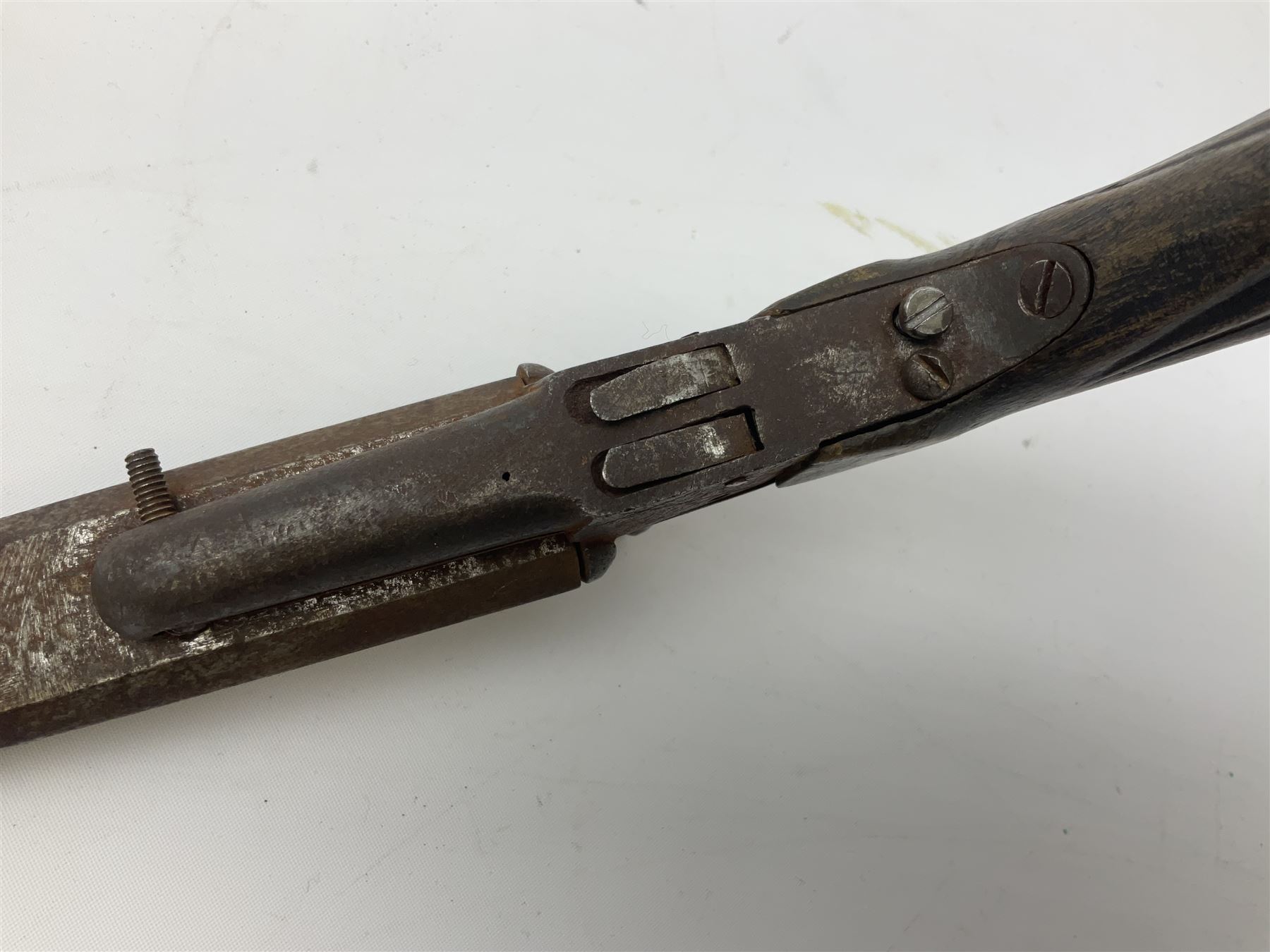 19th century Belgian 9mm side-by-side double barrel pin-fire pocket pistol with 11cm octagonal single block barrel, drop-down triggers and carved walnut stock L22.5cm overall