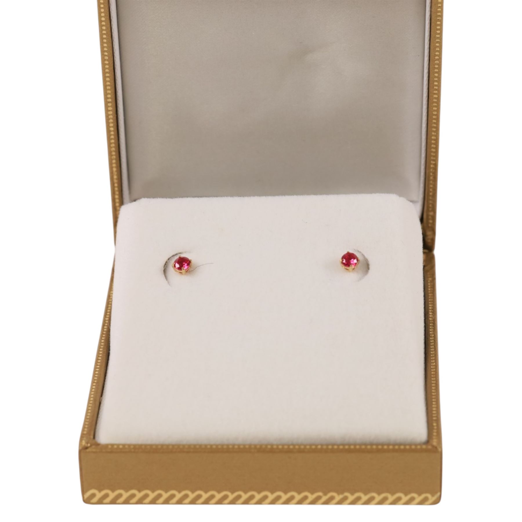 Pair of 9ct gold ruby stud earrings, boxed