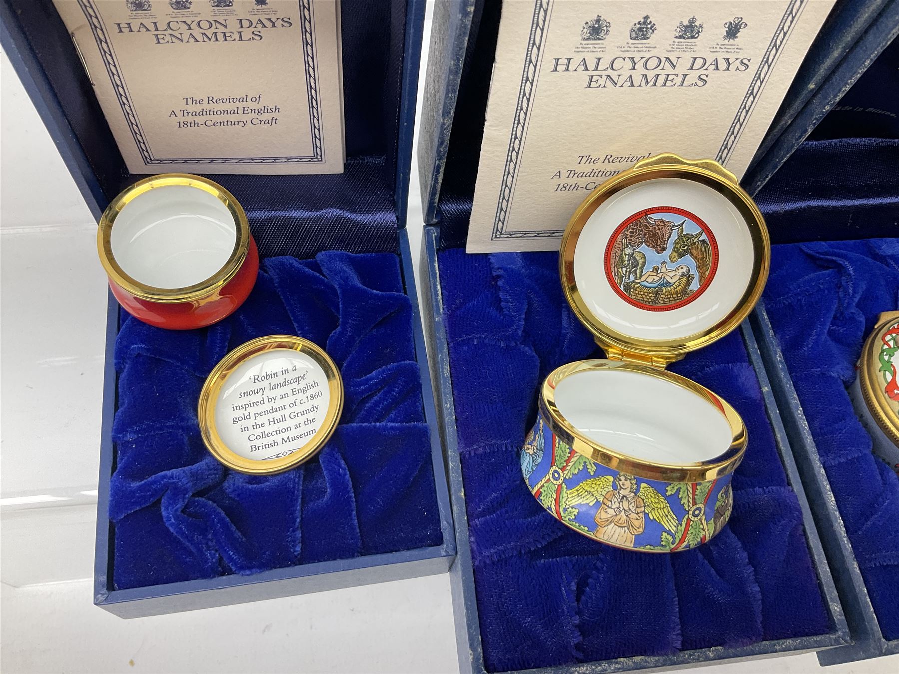 Eight Christmas themed Halcyon Days enamel boxes, and a Halcyon Days enamel bonbonniere modelled as a snowman, each in fitted box 