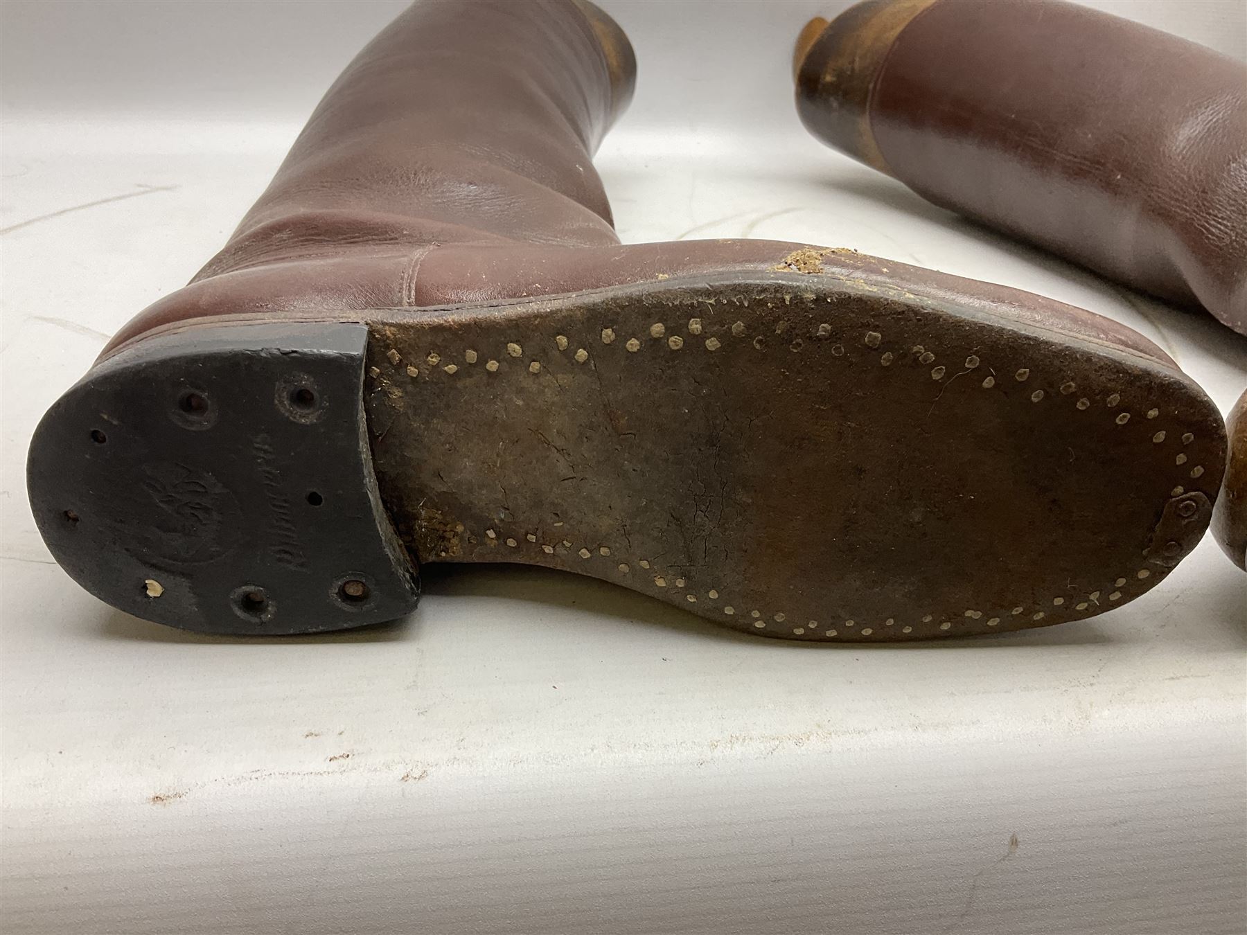 Pair of WW1 style Army Officer's brown leather full leg riding boots with Alkit four-piece wooden boot trees; and two officer's Sam Browne leather belts with cross-straps, one with sword frog (4)