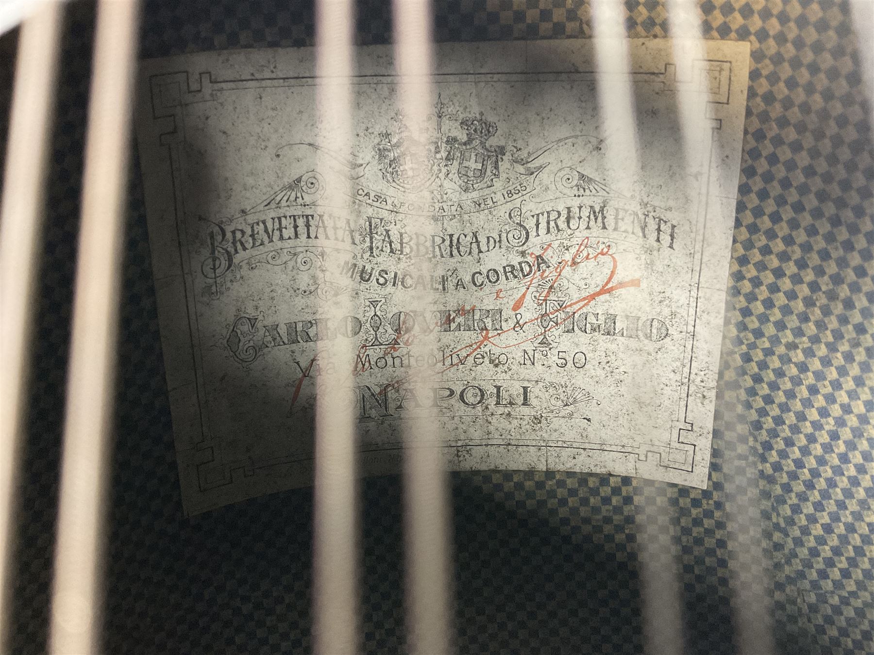 Italian mandolin, with foliate inlaid scratchplate, paper label inscribed 'Carlo Loveri & Figlio of Napoli', L62cm