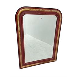 Arched top wall mirror with bevelled plate, in moulded red painted and gilt frame