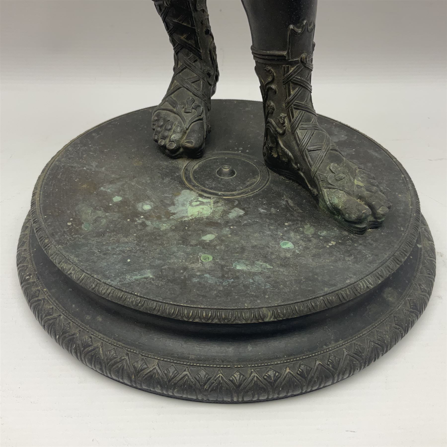 Bronzed classical nude male figure, upon a stepped circular base, H61cm 