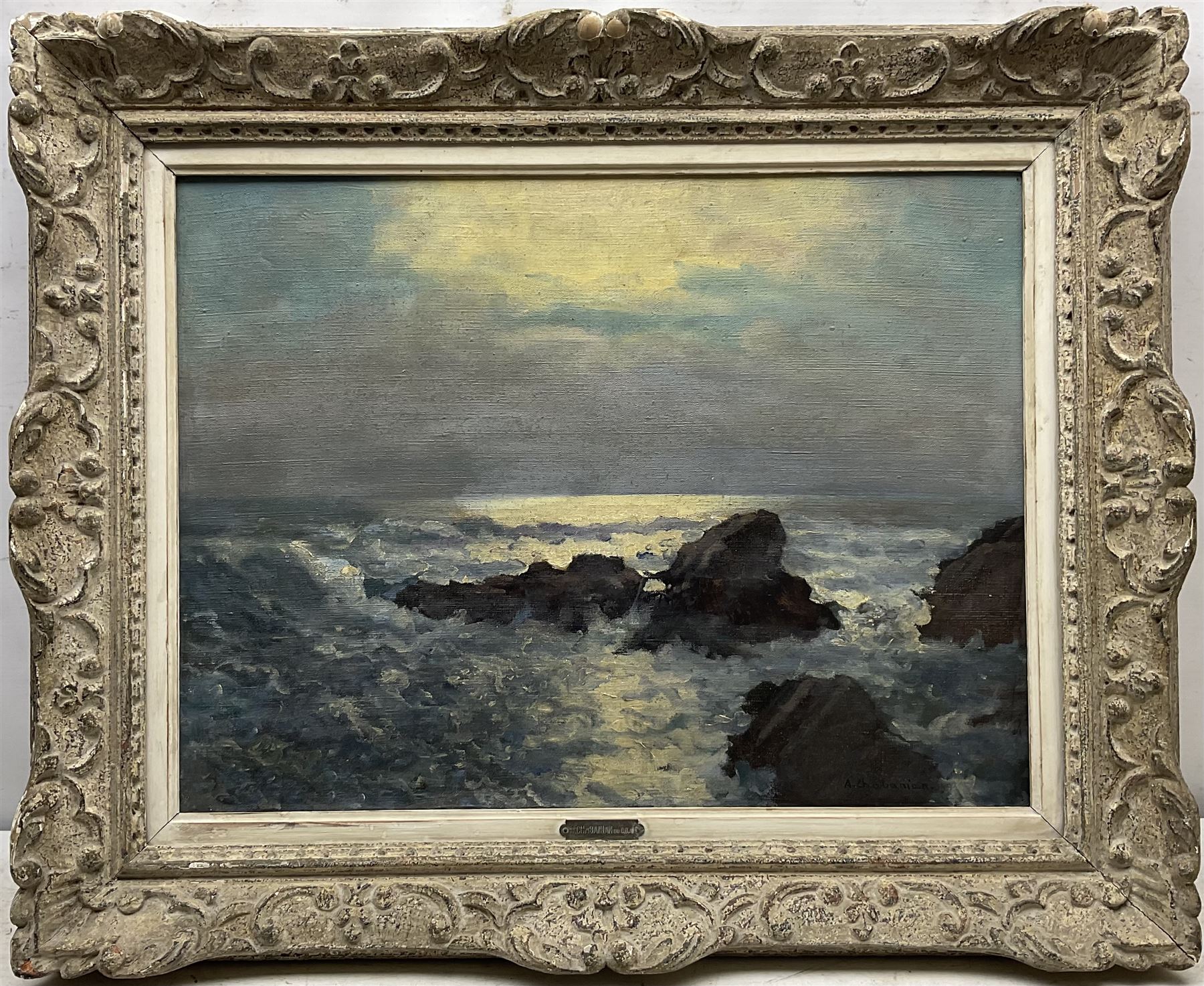 Arsene Chabanian (Armenian 1864-1949): Rocky Coastal scene by Moonlight, oil on canvas signed 45cm x 60cm