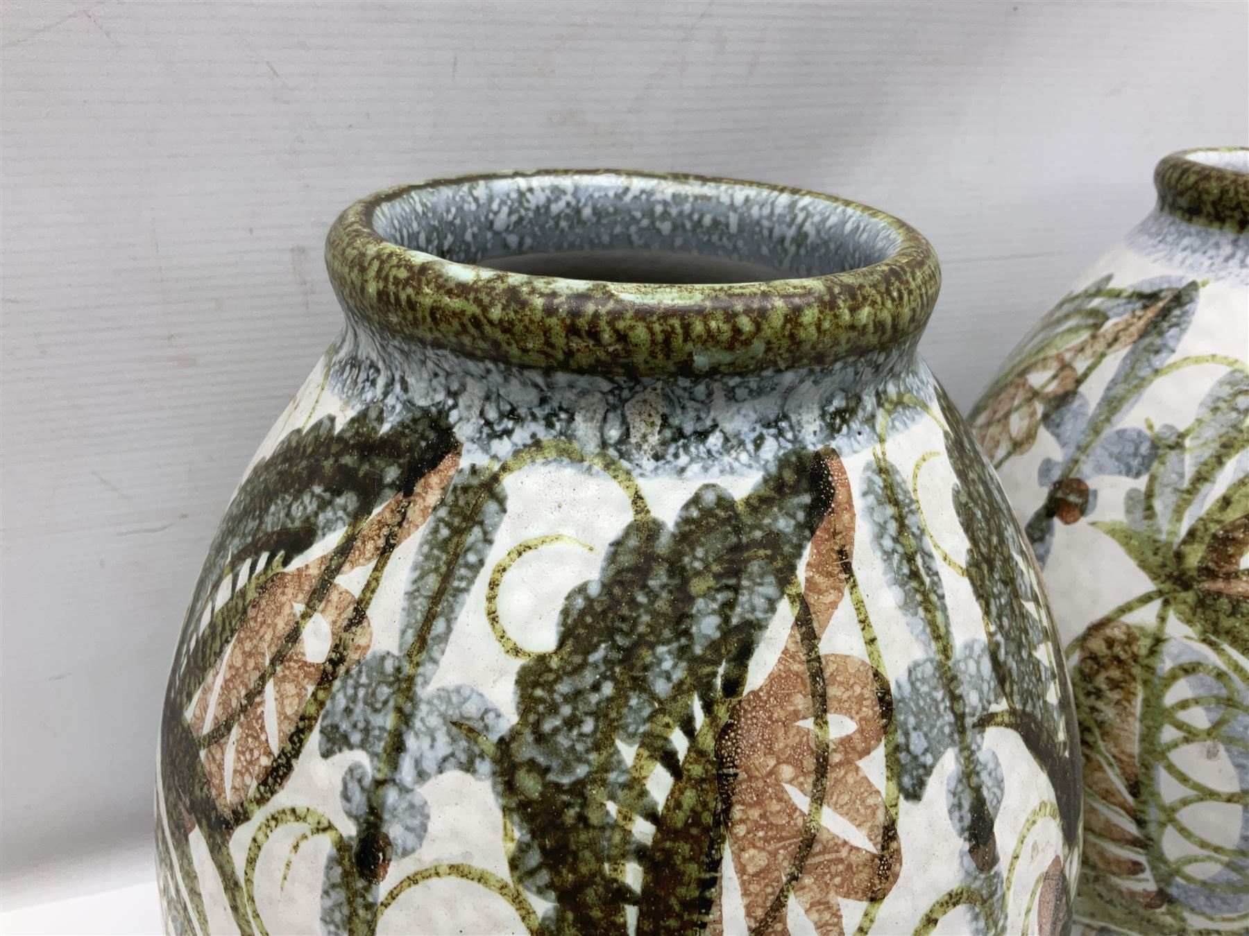Pair of Denby Glyn Colledge stoneware vases of ovoid form with floral decoration over cream ground, together with a large bowl in a similar design, vases H32cm