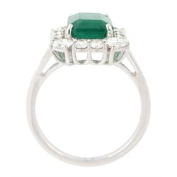 18ct white gold emerald and diamond cluster ring, single octagonal cut emerald of approx 2.90 carat, surrounded by twelve round brilliant cut diamonds and four oval cut diamonds to each corner, stamped 18K, total diamond weight approx 0.90 carat