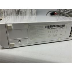 Nintendo Wii console, four controllers with cases and four nunchucks, Wii sensor bar, balance board and dance mat. Guitar hero wireless guitar for Wii and Redoctane wired guitar. Nintendo DS lite handheld gaming console, console and game cases and Guitar Hero Redoctane Guitar Grip. Selection of Nintendo Wii and Nintendo DS lite games to include Super Mario Galaxy, Guitar Hero, Wii Fit, Legend of Zelda games etc. Archos AV400 Series pocket video recorder with accessories, cradle and remote, in three boxes