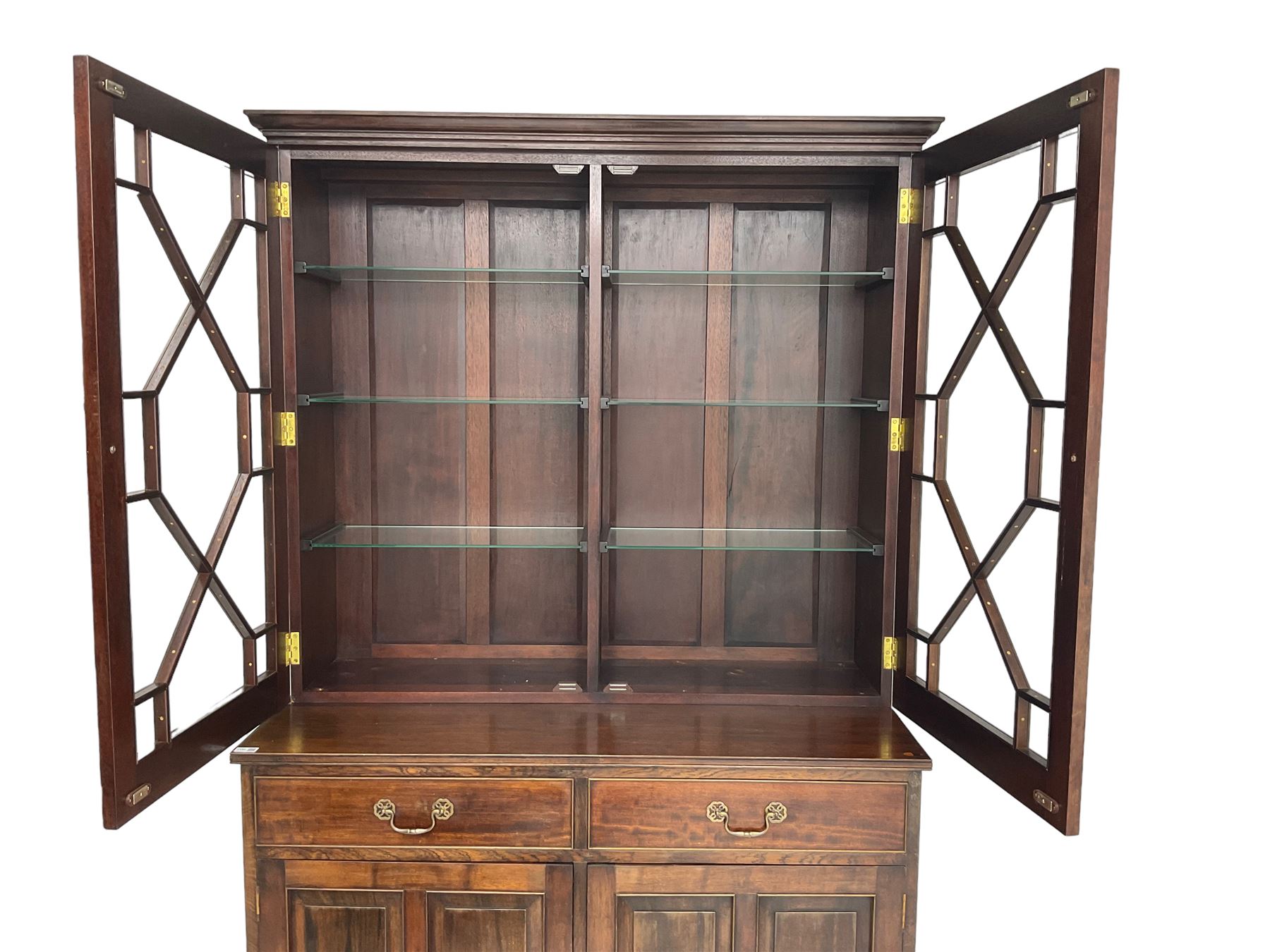 Acorn Industries - Georgian design mahogany bookcase on cupboard, fitted with two astragal glazed doors enclosing three glass shelves, base with two cock-beaded drawers over two panelled cupboards, inlaid with acorn signature, by Alan Grainger, Brandsby