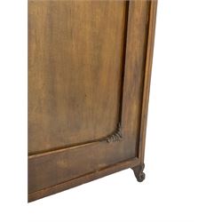 Early 20th century Italian walnut armoire wardrobe, the pierced and scrolling pediment carved with acanthus leaf detail, flanked by two scrolling cartouche with matching corbels below, the two panelled doors with applied carved rinceaux slips, with a central spiral turned upright, enclosing single shelf and hooks, raised on scroll feet