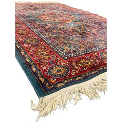 Persian design blue ground rug, the field decorated with Herati motifs and central floral medallion, repeating guarded border decorate with flower heads and trailing leafy branches 