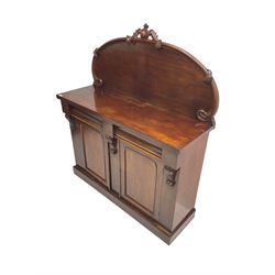 Victorian mahogany chiffonier sideboard, raised back with central cartouche pediment, fitted with two two drawers over two panelled cupboards, flanked by foliate corbels