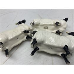 Seven Beswick figures of sheep comprising three ewes and four lambs, together with a figure of a sheepdog (8)