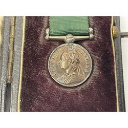 Victoria Volunteer Officers’ Decoration, V.R. cypher, hallmarked silver London 1892, with integral top riband bar and ribbon, unnamed; the matching miniature; and Victoria 'For Long Service in the Volunteer Force' miniature medal with ribbon in original case (3)