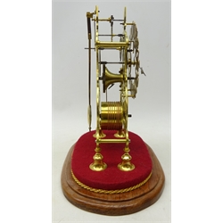  20th century brass Skeleton timepiece, silvered chapter with relief brass Roman numerals, single train fusee movement, scrolled frame on bell turned feet, H29cm, on oval wooden plinth under glass dome, H36cm max  